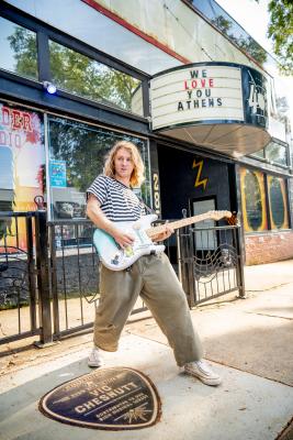 Guitarist outside 40 Watt.