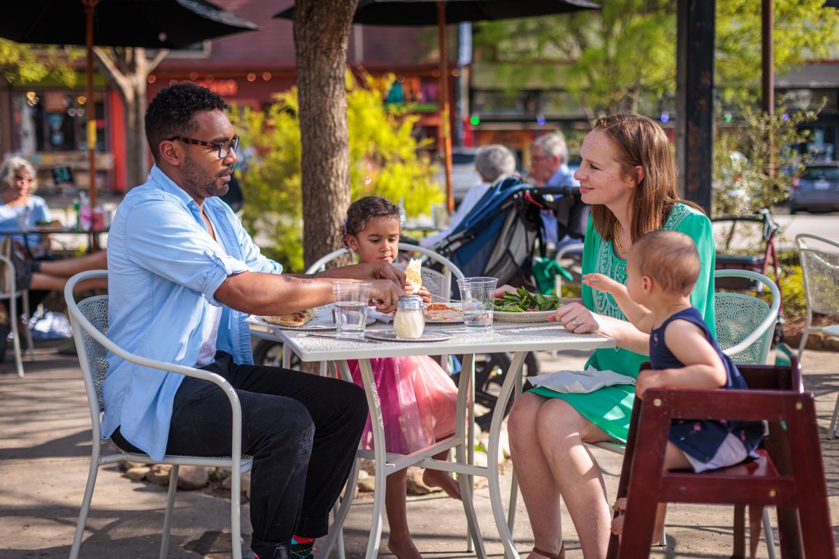 A family at Ted's Most Best, on the patio.